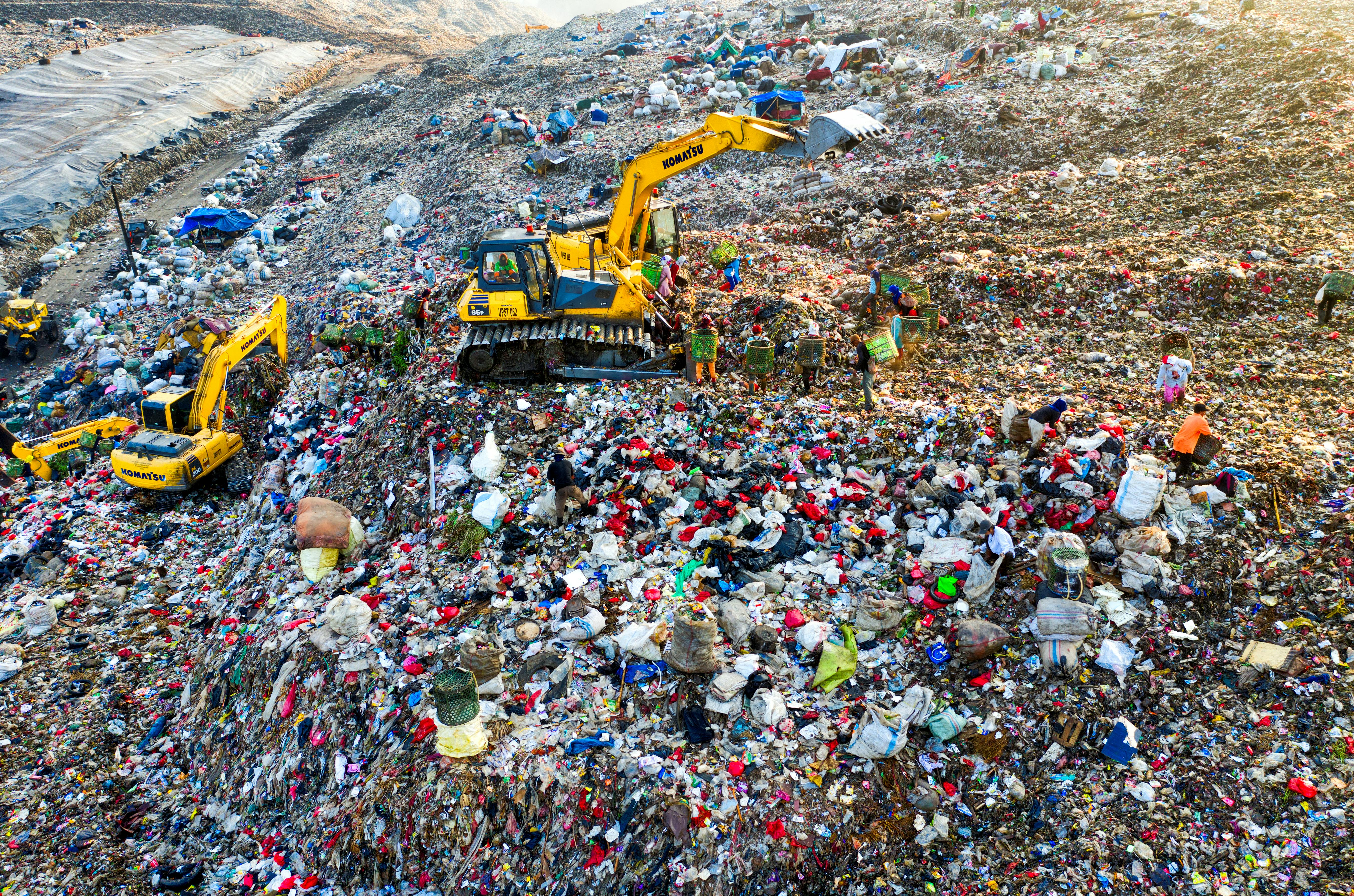 yellow tractor on a landfill