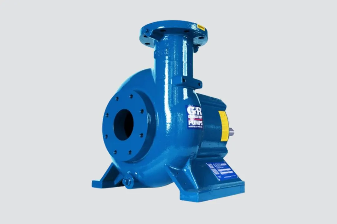 A pile of logs sitting on top of a sandy beach