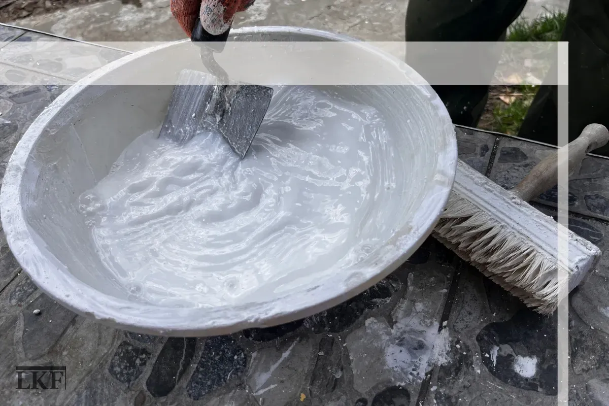 A vetted installer re-applying the tiles