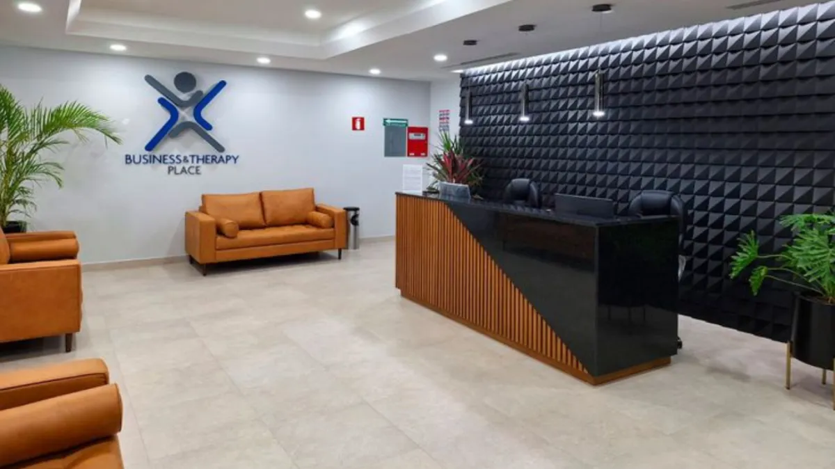 a dental room with a chair and a monitor