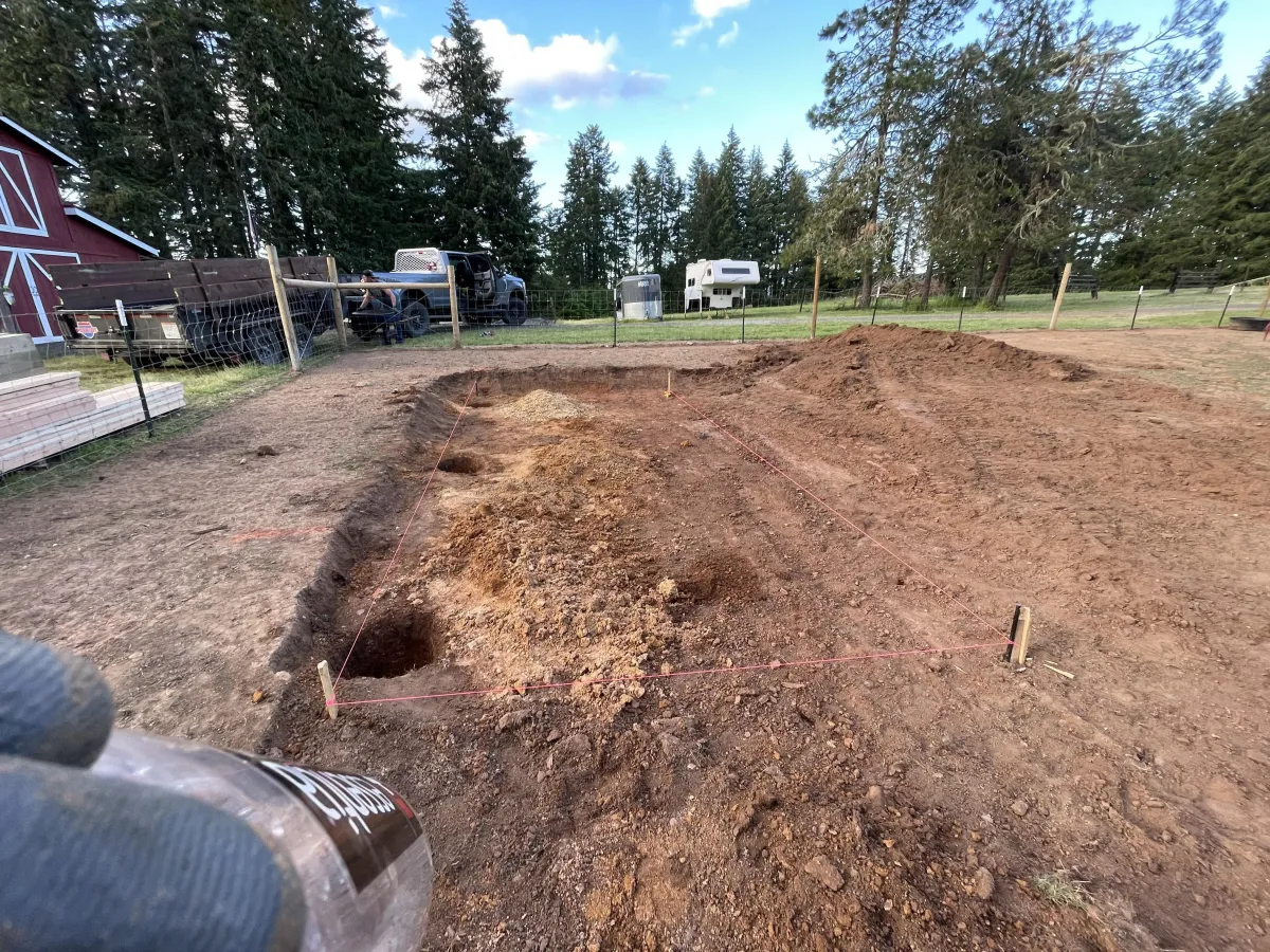 Post hole excavation and layout for custom goat barn construction in Cottage Grove, Oregon