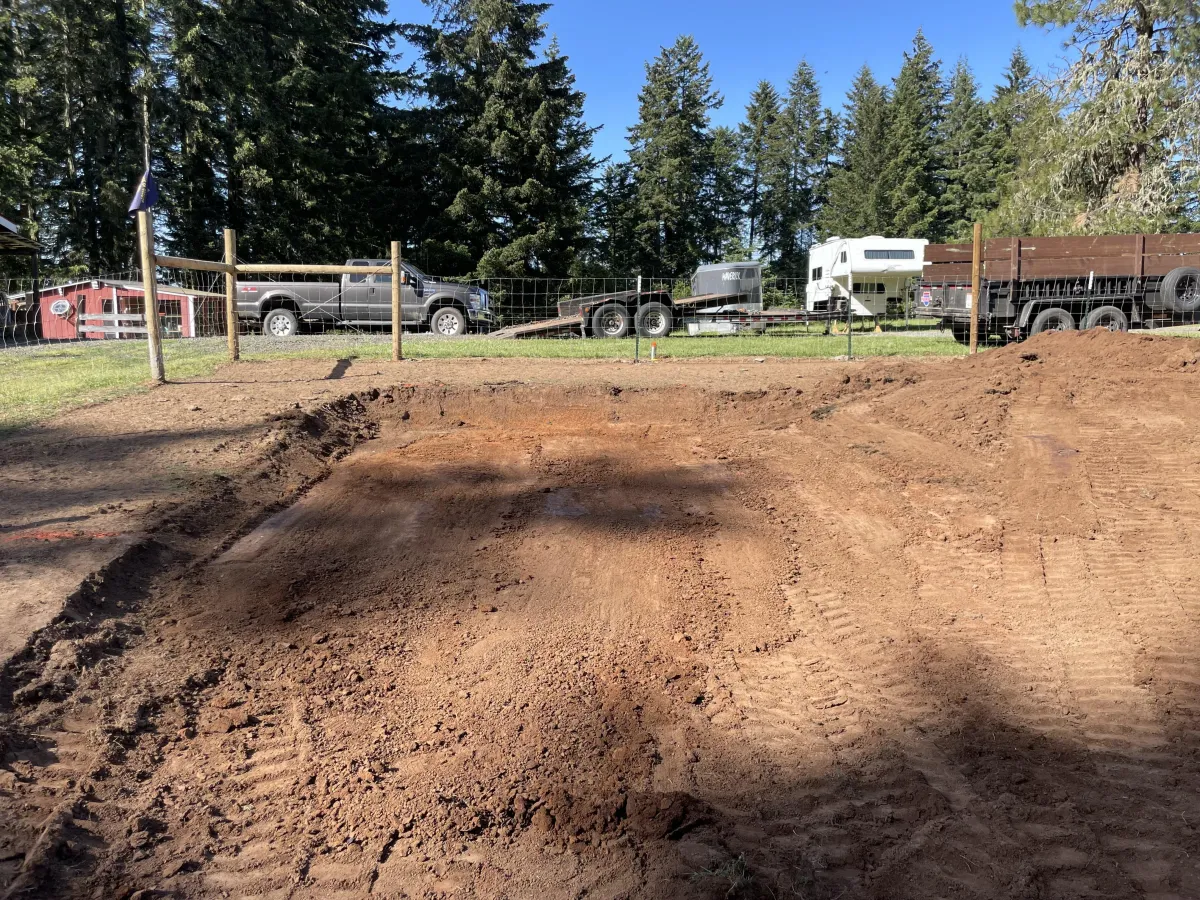 Ground preparation and grading for custom goat barn construction in Cottage Grove, Oregon