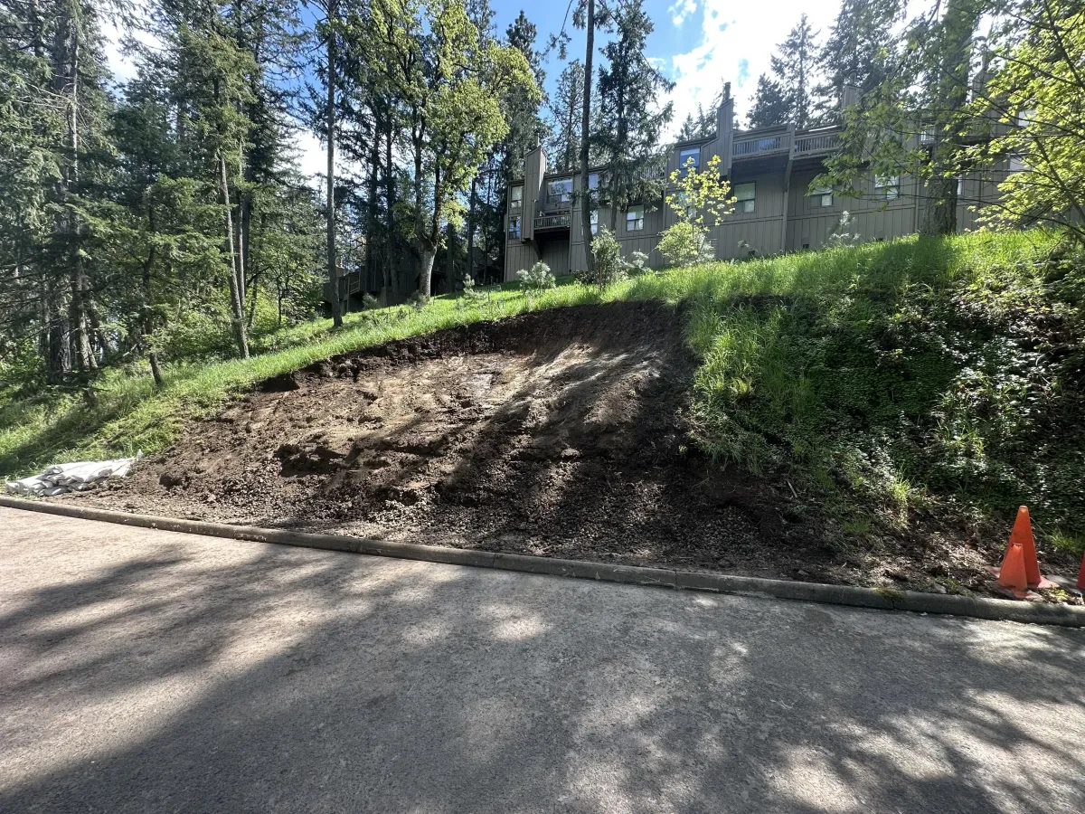 Completed landslide cleanup and slope stabilization in the South Eugene Hills, restoring safe roadway access