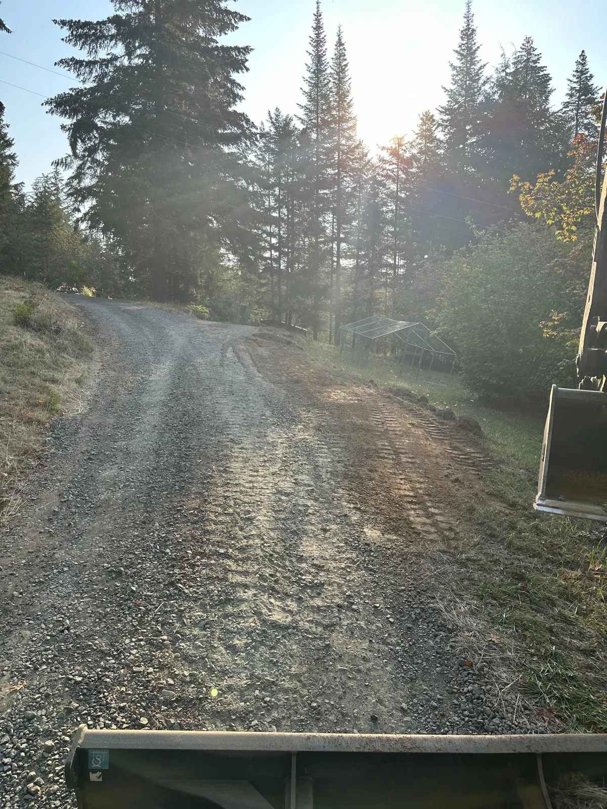 Final landslide cleanup results with reinforced slope and cleared roadway in the South Eugene Hills, Eugene Oregon
