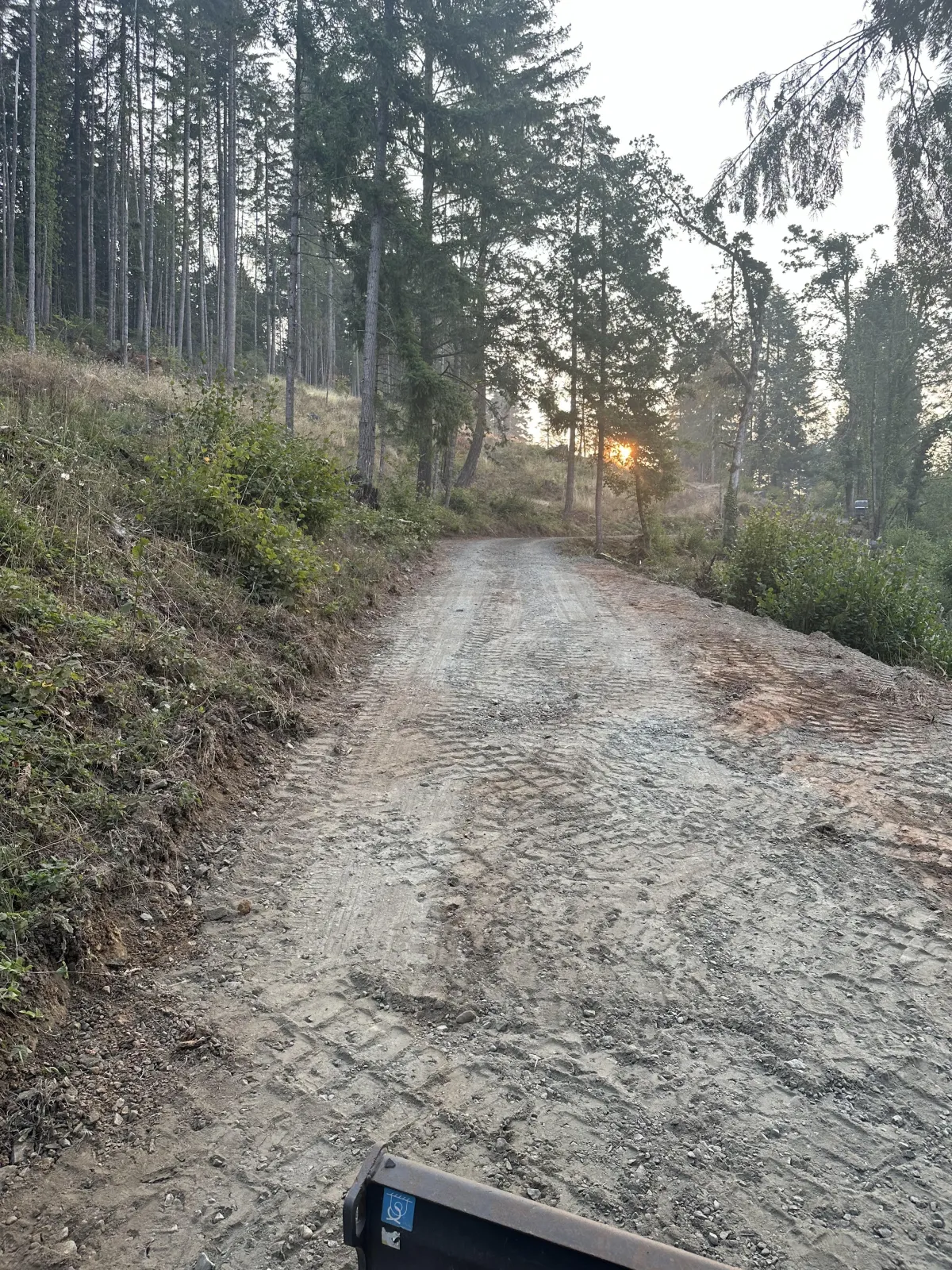 Emergency landslide cleanup using excavator to remove unstable soil in South Eugene Hills, Oregon