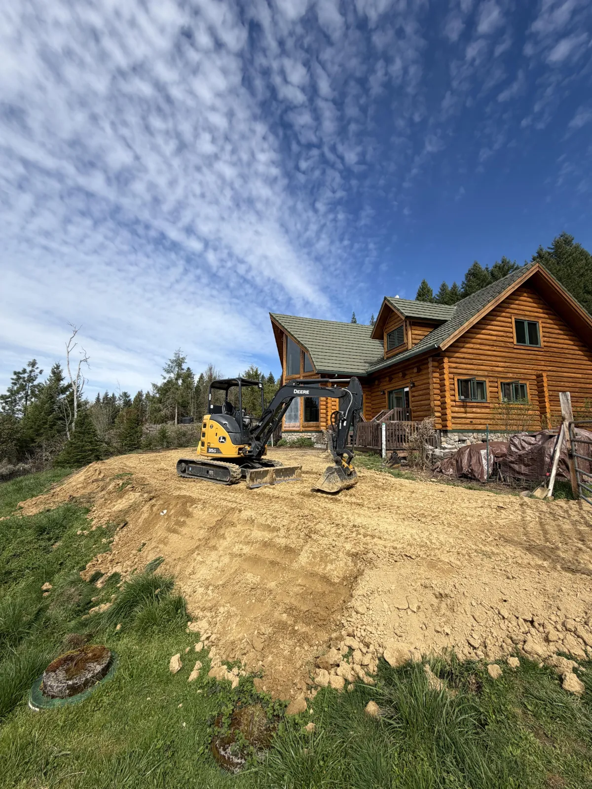 Framing and roof structure in progress for custom goat barn construction in Cottage Grove, Oregon