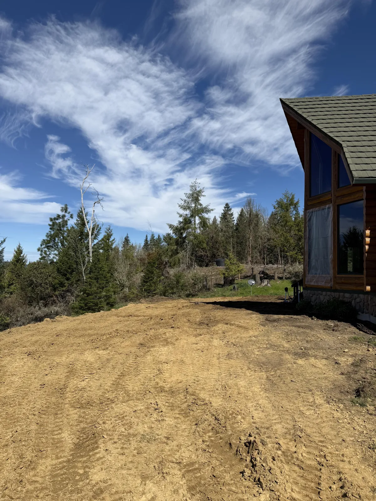 Setting and bracing posts during custom goat barn construction in Cottage Grove, Oregon