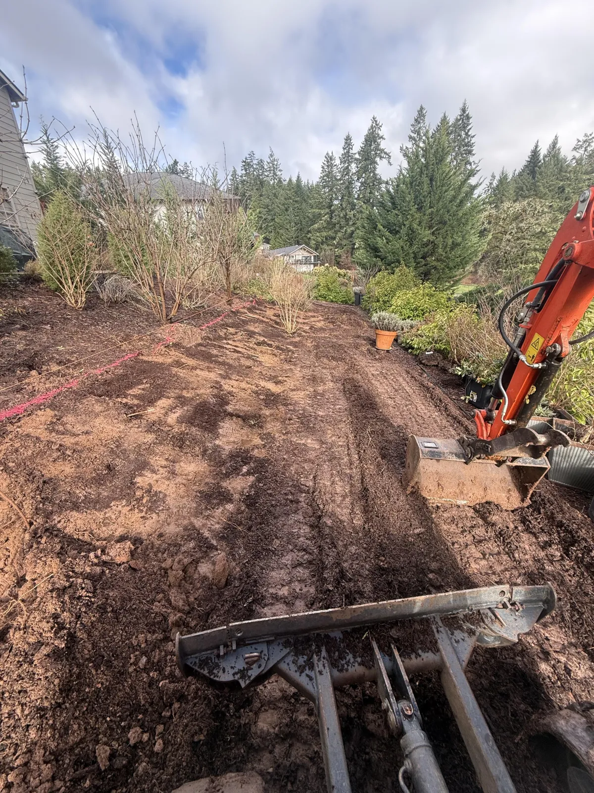 Post hole excavation and layout for custom goat barn construction in Cottage Grove, Oregon