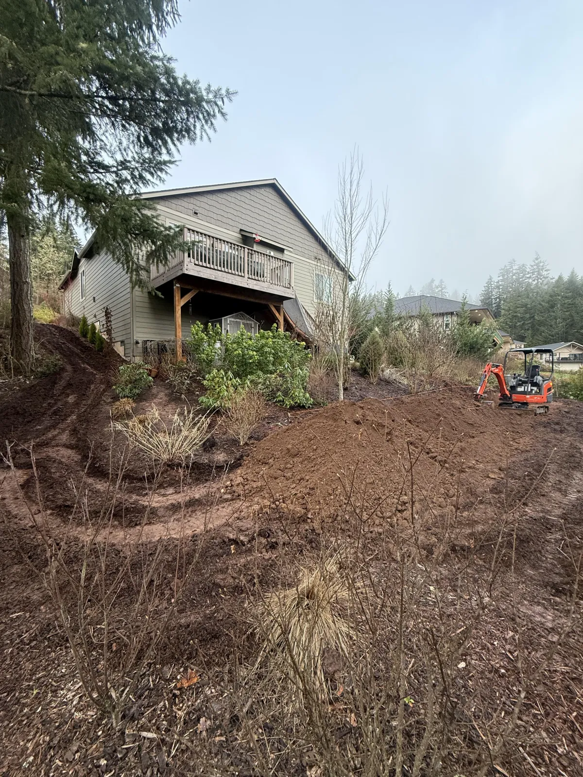 Setting and bracing posts during custom goat barn construction in Cottage Grove, Oregon