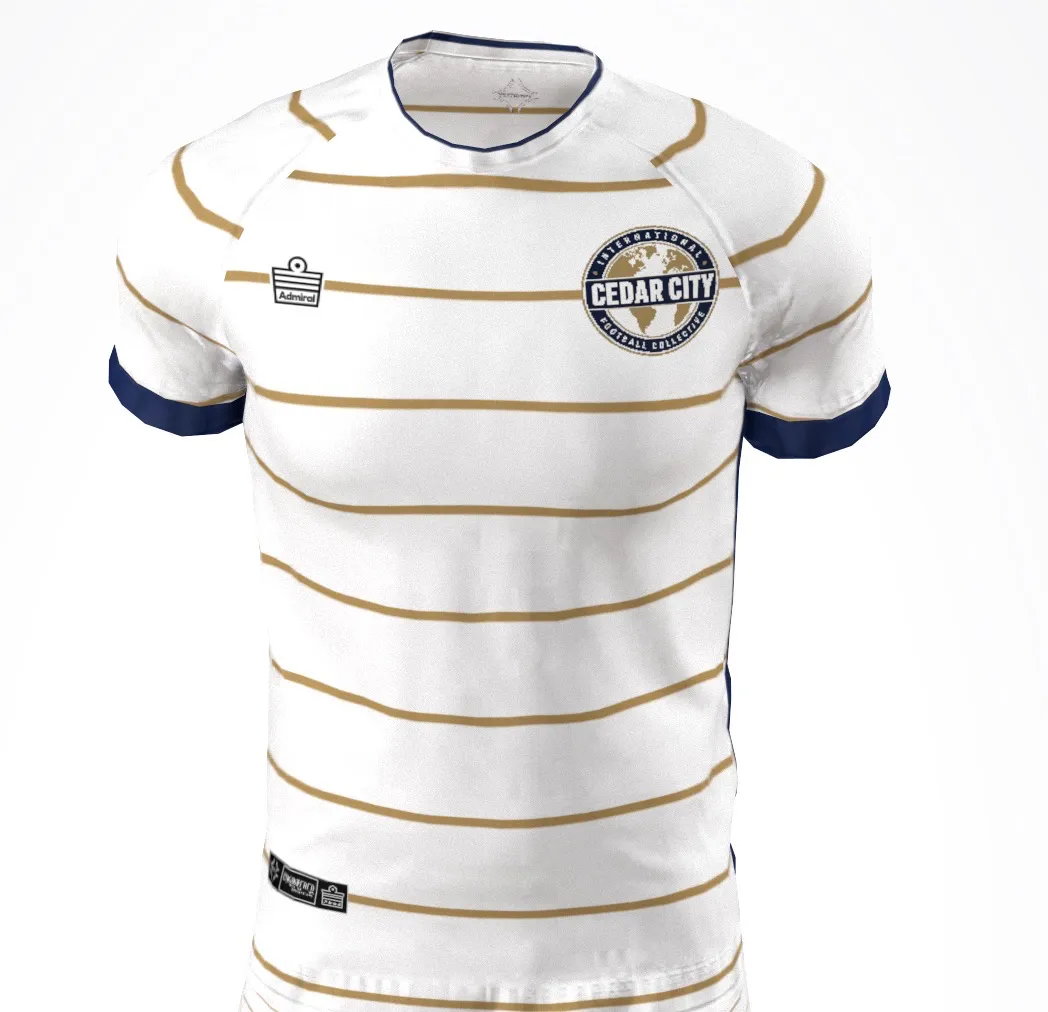 Front of the IFC Cedar supporter jersey: white with gold stripes, club crest and navy sleeve trim