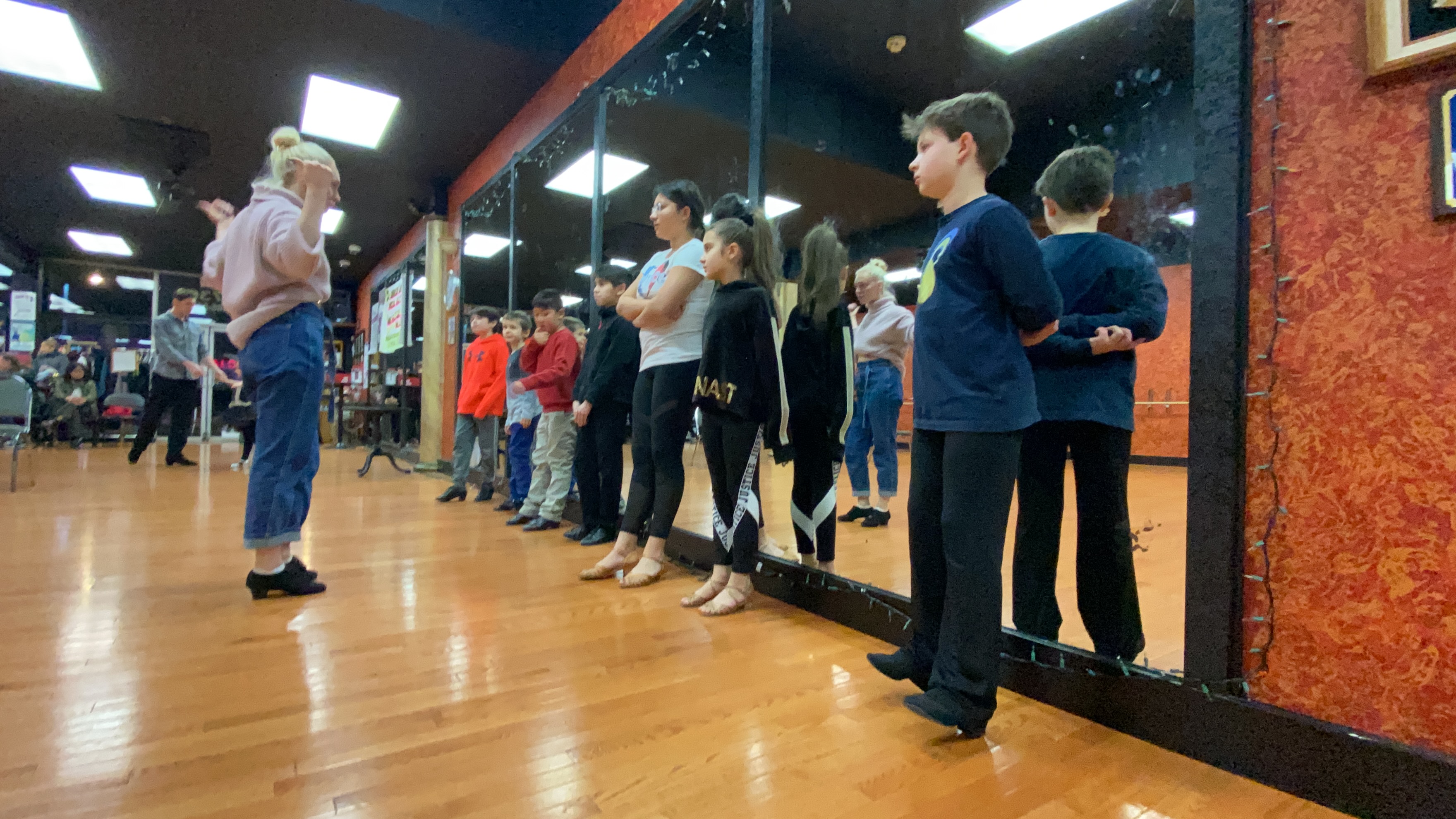 Kids ballroom dance group smiling and practicing