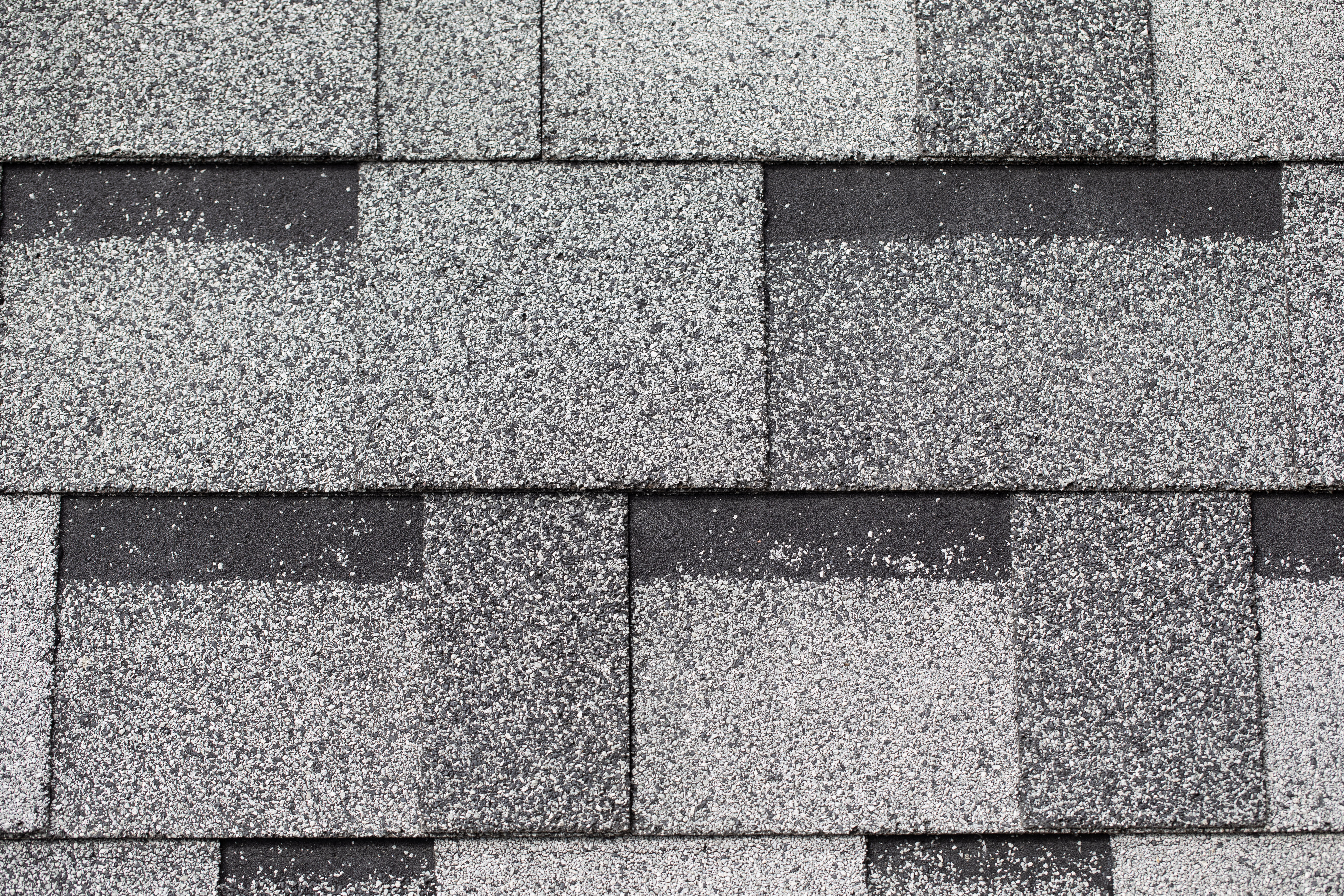 Examples of asphalt shingles provided by Reese Roofing for roofing services.