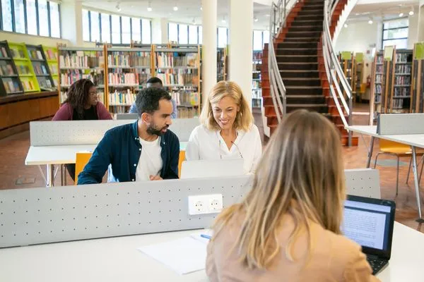 Students working together at a library table