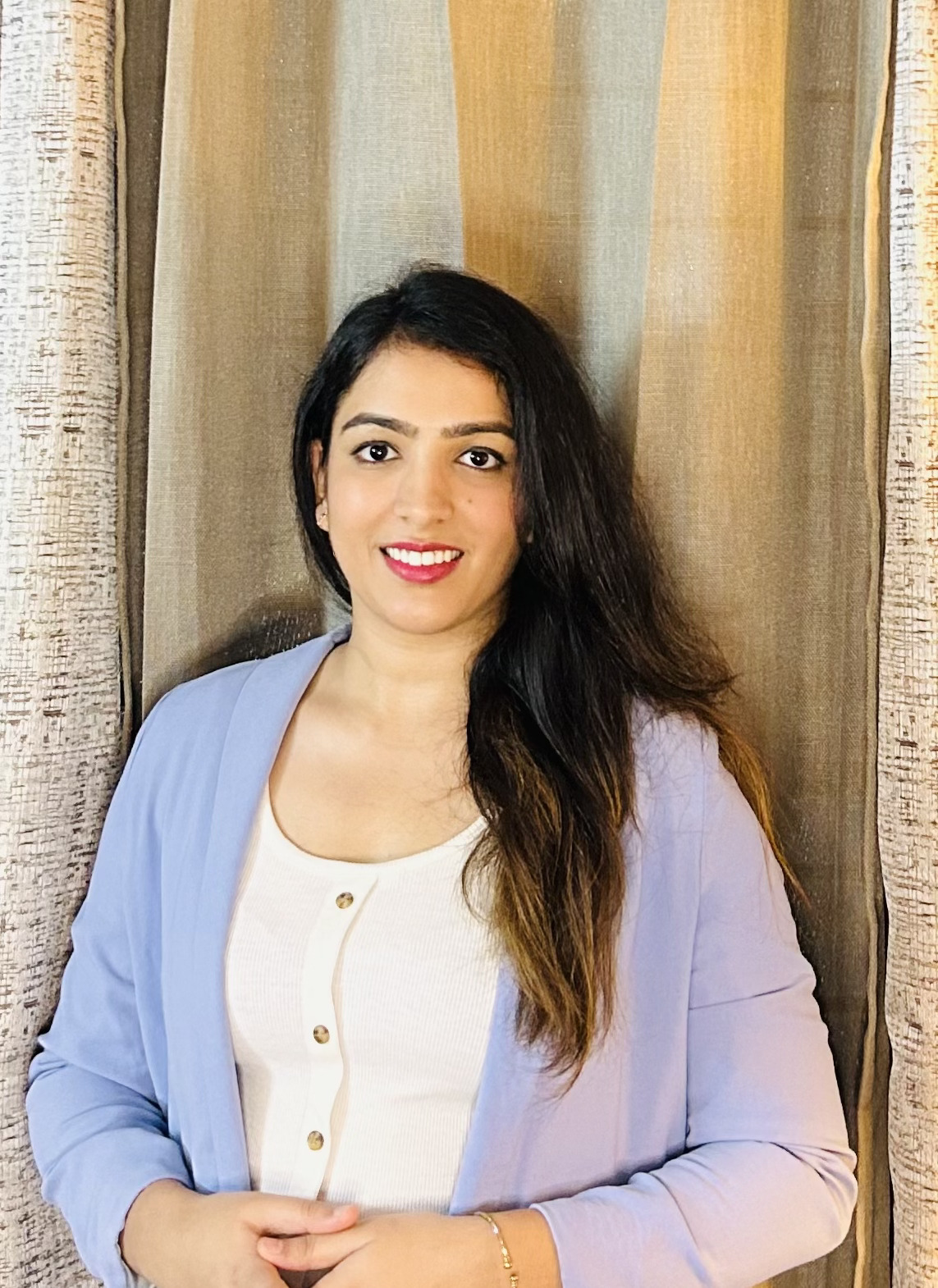Confident mid-career professional holding a tablet with a chart in a modern home office.