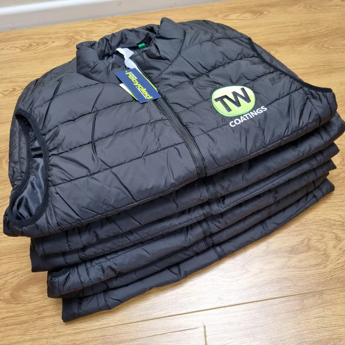 Two embroidered customised bodywarmers and a customer review.