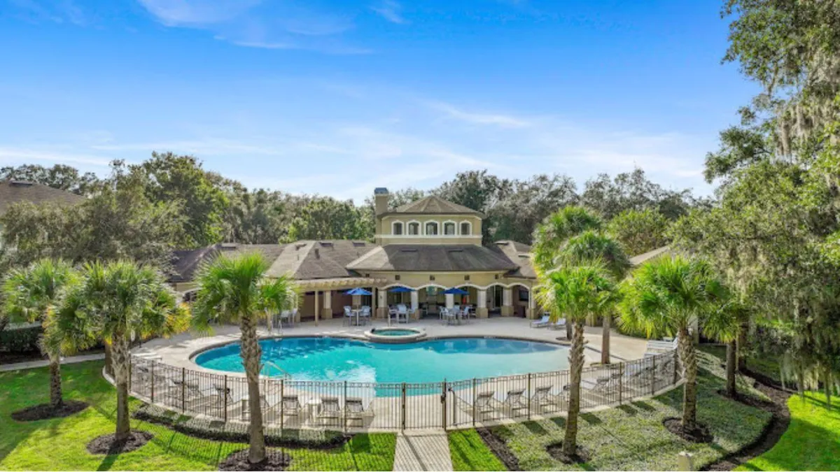 Luxurious pool and lounge area at a Rise Capital Investments real estate property, highlighting resort-style amenities for residents and investors.