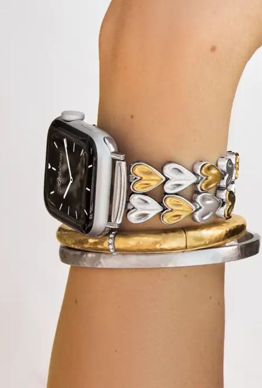 Brighton heart-link watch band with stacked silver and gold bracelets.