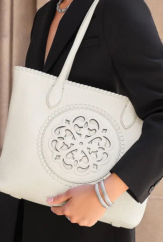 White Brighton tote handbag with decorative cutout design.