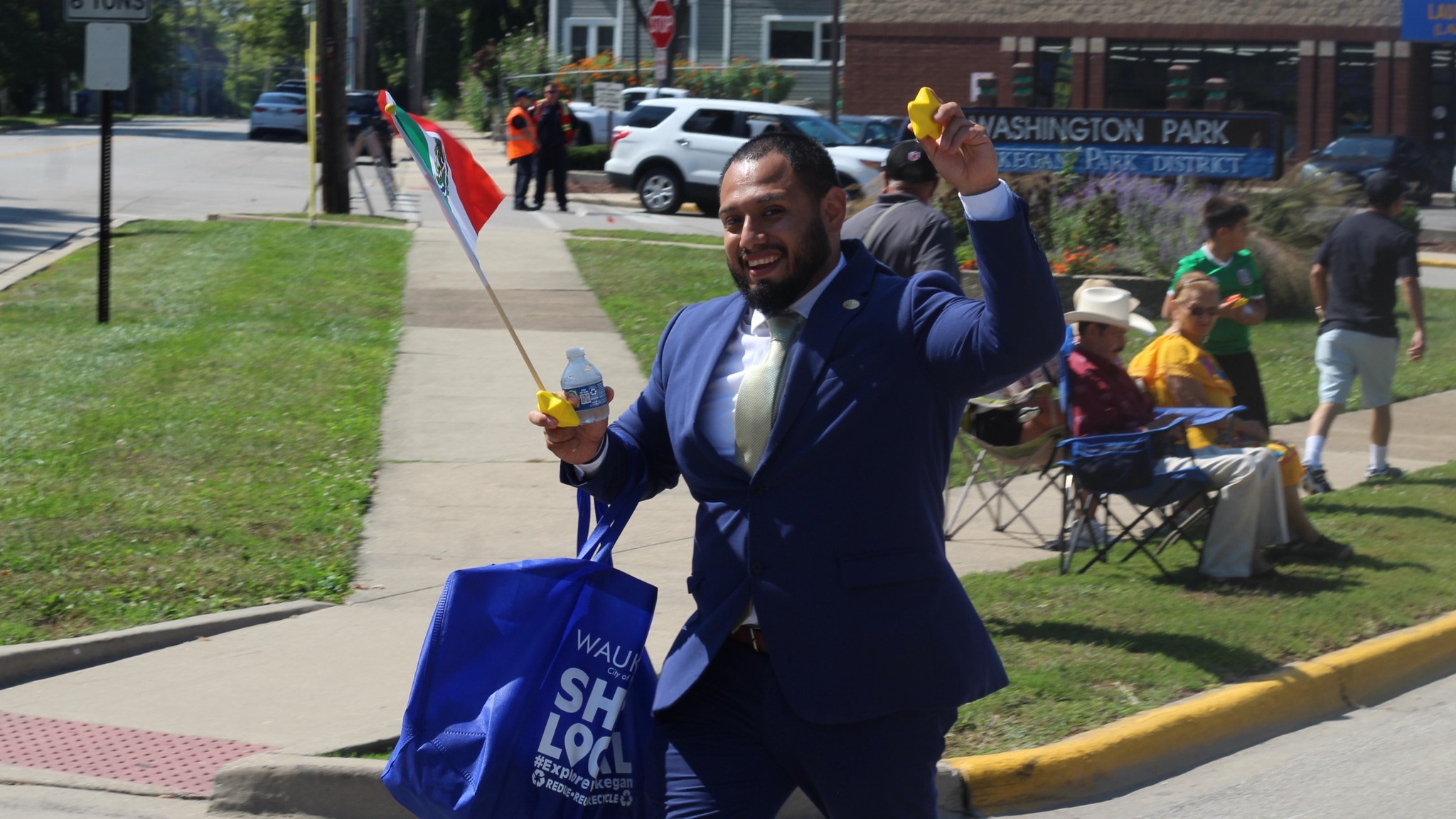 Alderman Victor Felix talking with 4th Ward residents on a neighborhood street
