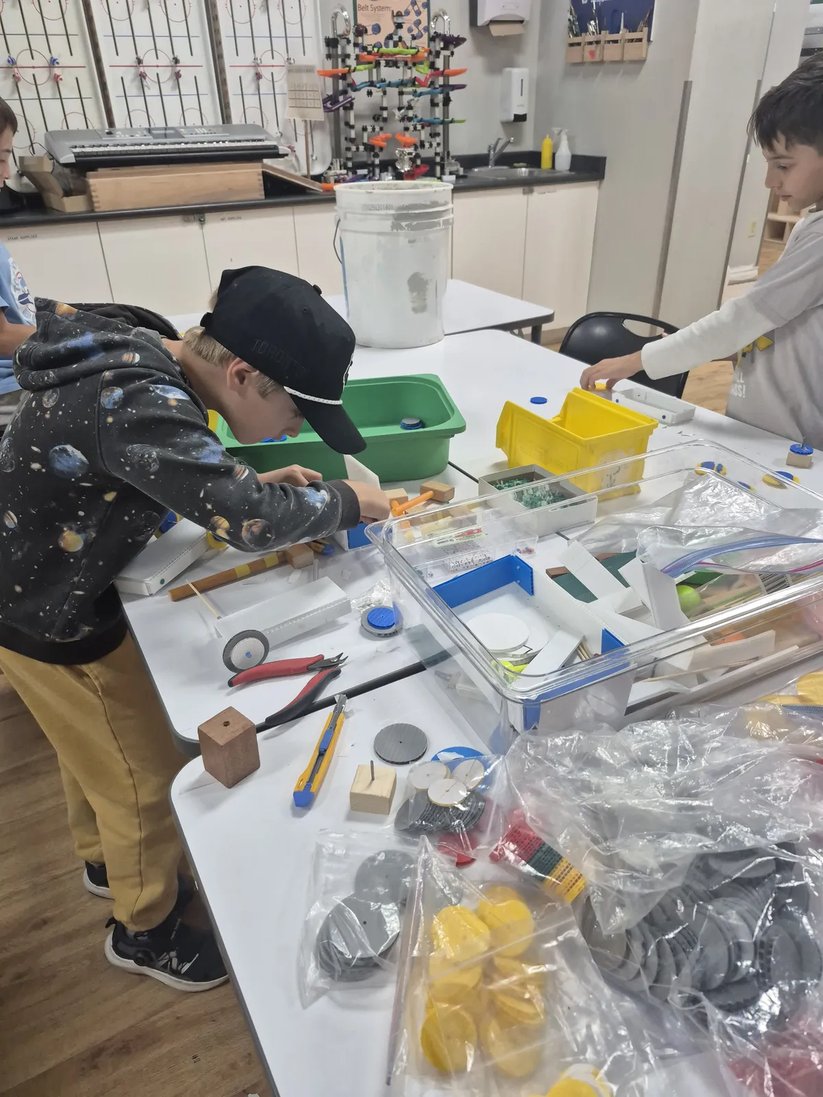 Students exploring creative projects and materials at Evergreen after the school day