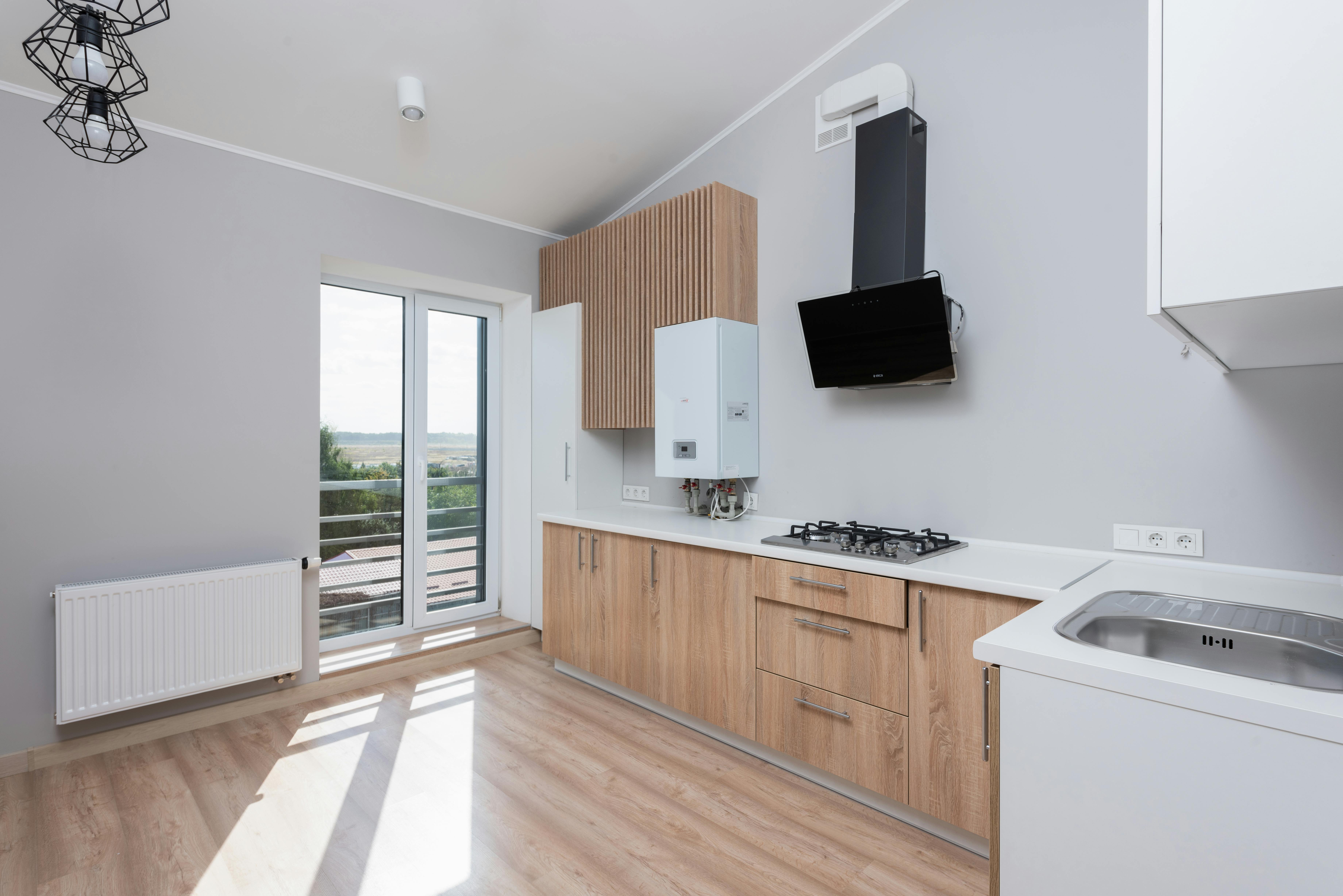 Cleveland Kitchen & Bath Remodel team designing an open-concept kitchen with elegant lighting and island seating
