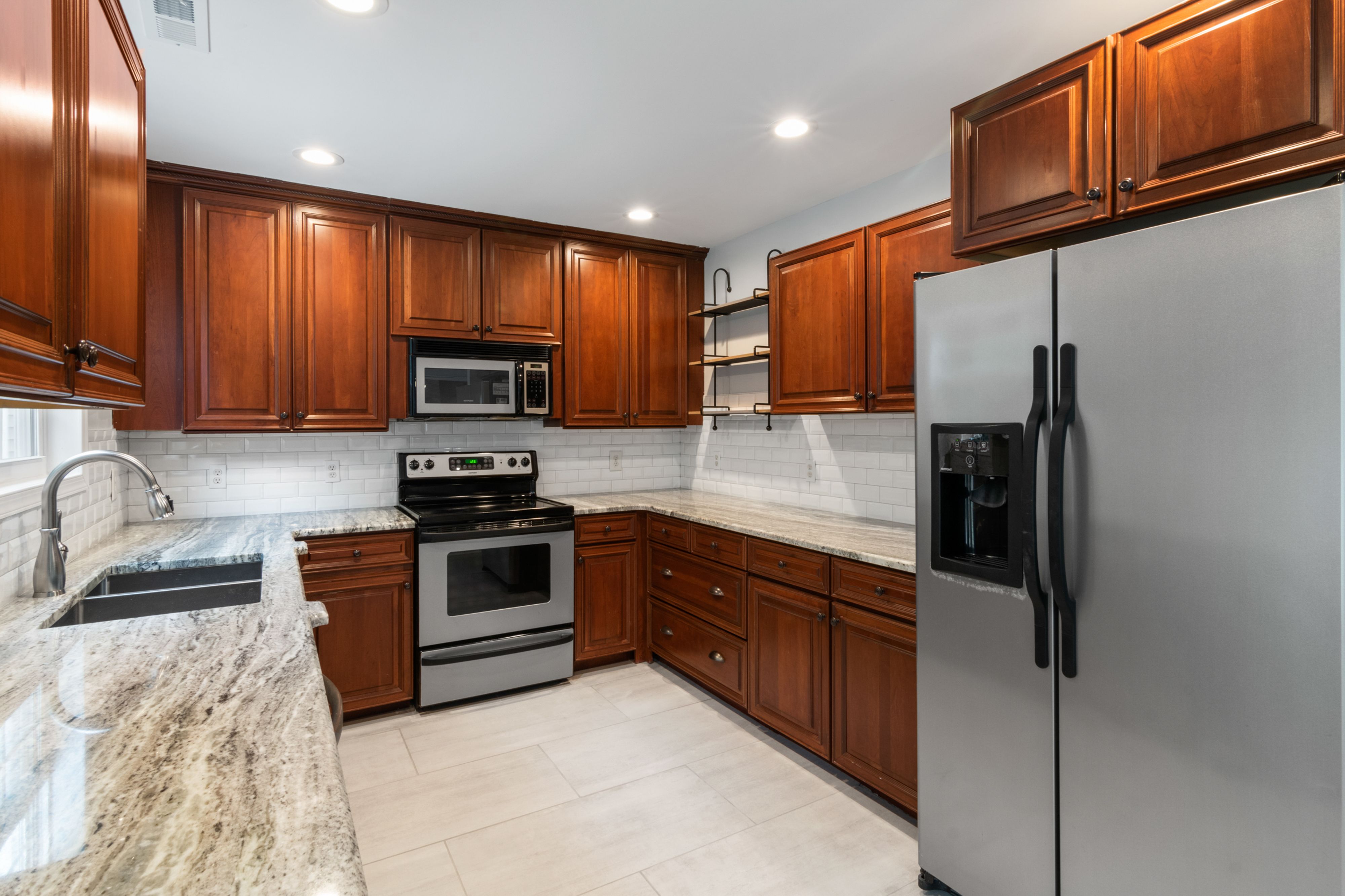 Lake Charles kitchen remodel with modern white cabinets and granite countertops