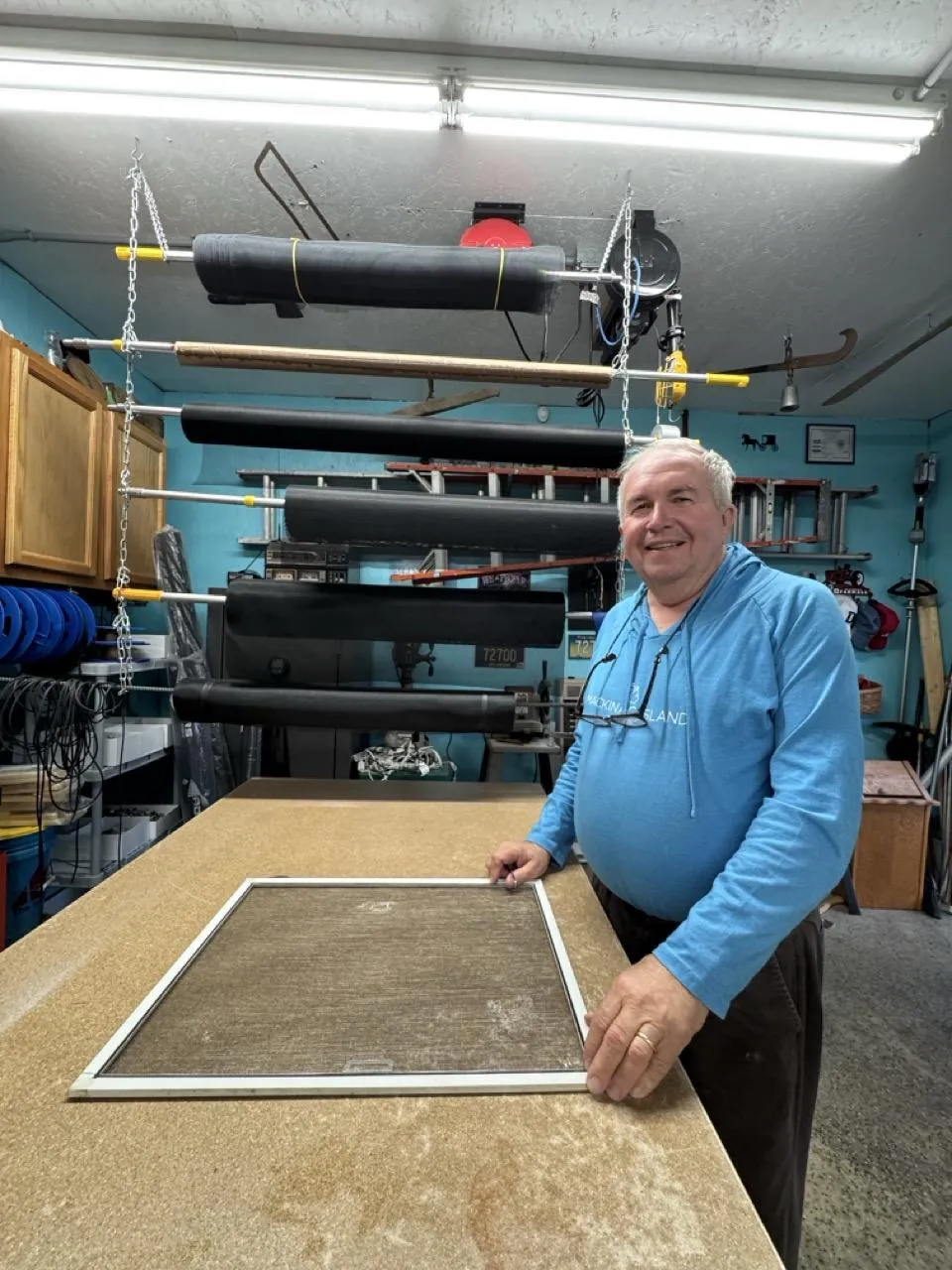 Window screen repair being performed