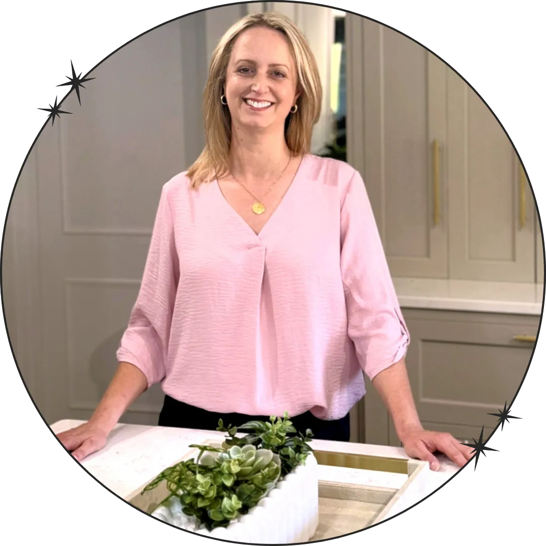 Picture of Becky from White Space in pink blouse in white kitchen