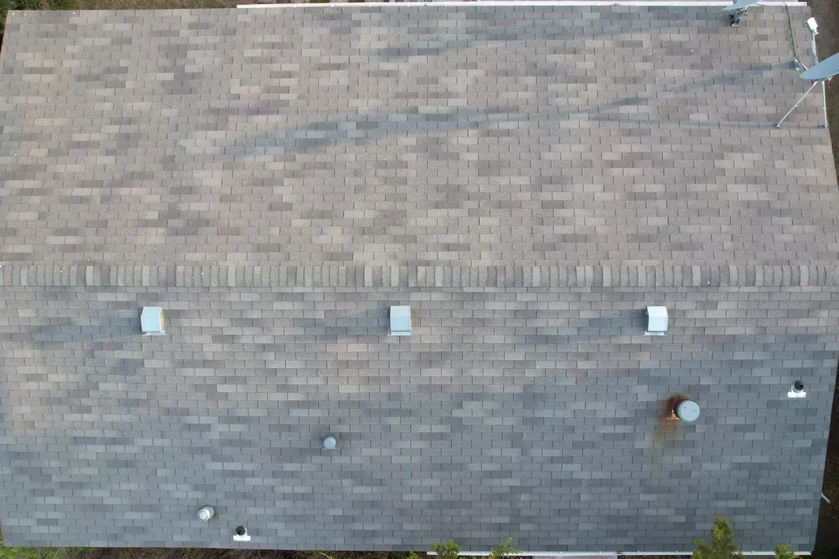 A photo of shingles on a roof.