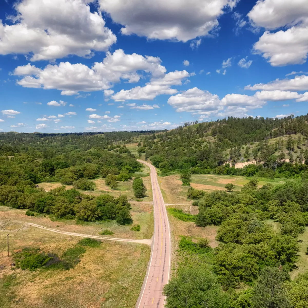 An aerial photo of the road going through Grass Mountain near Rosebud, SD.