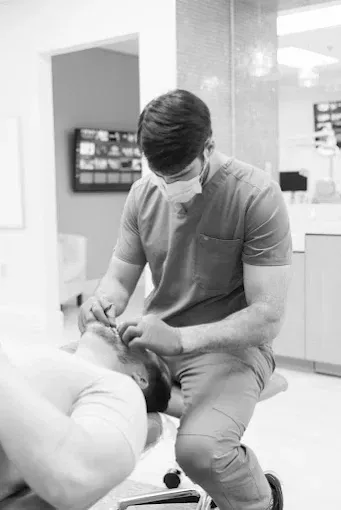 Dr Kragor custom fitting a Professional Athlete for his custom sports mouthguard