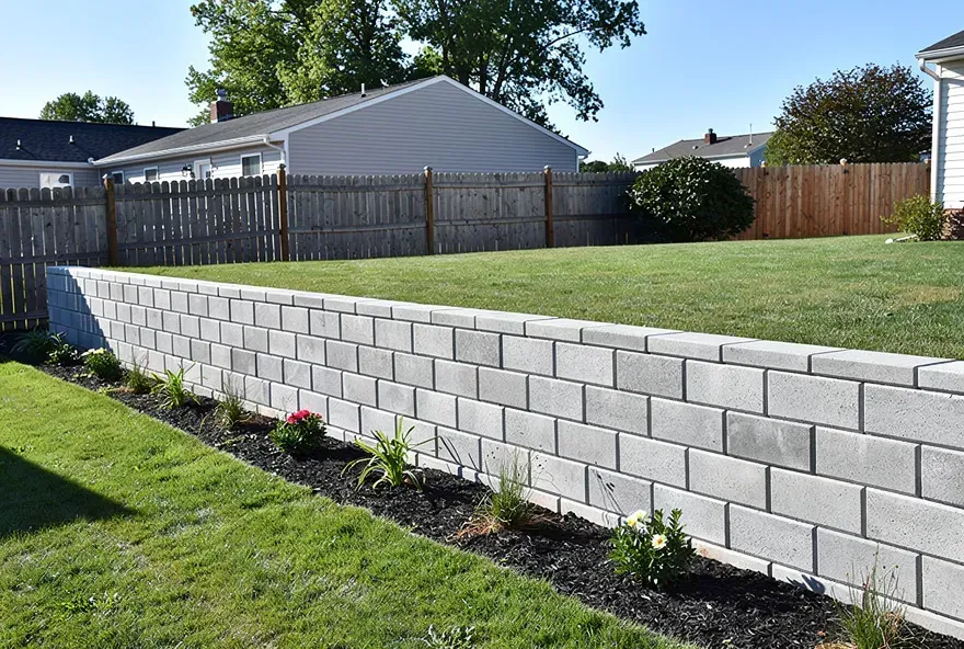 Freshly built concrete block retaining wall in a backyard in Bear, Delaware.