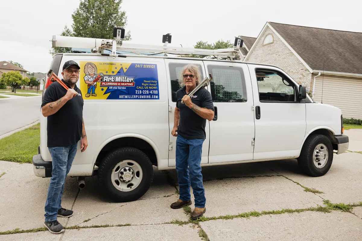 Crew in front of plumbing van