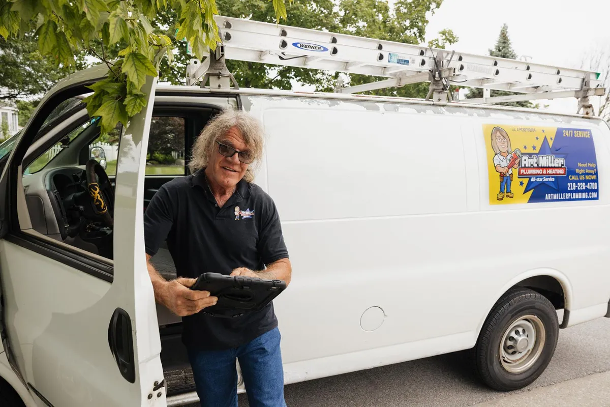 Crew in front of plumbing van