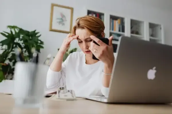 Stressed woman working at desk