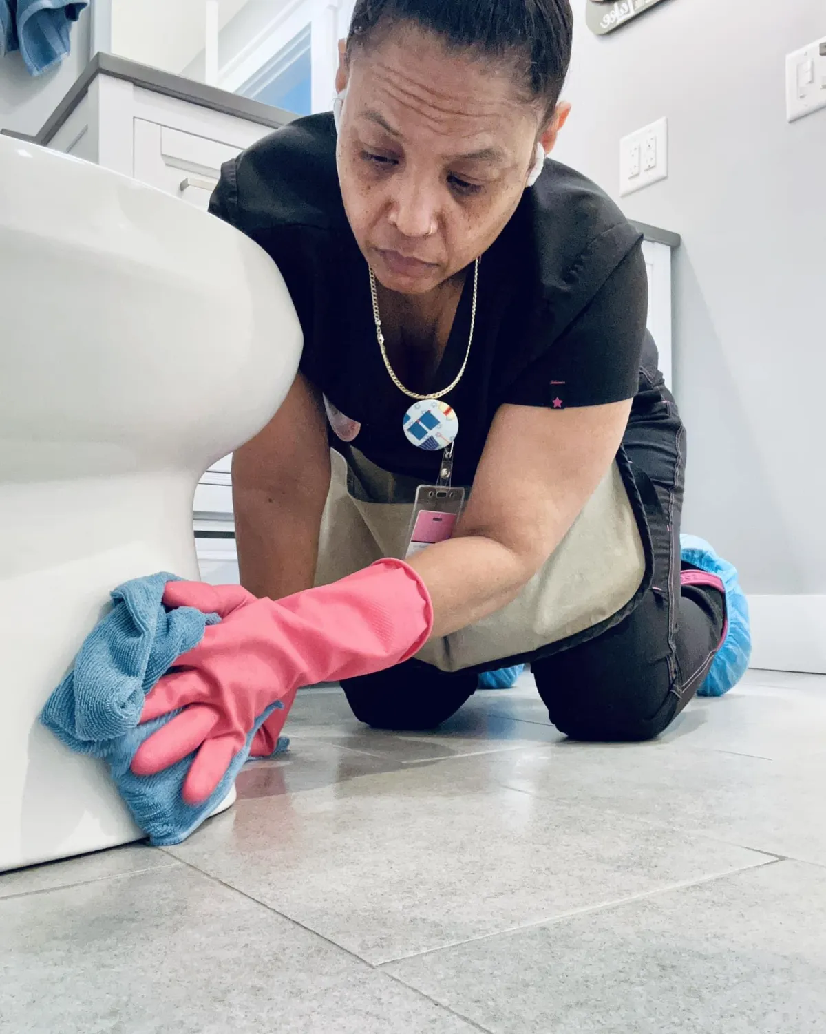 a woman deep cleaning a toilet in roanoke rapids, nc