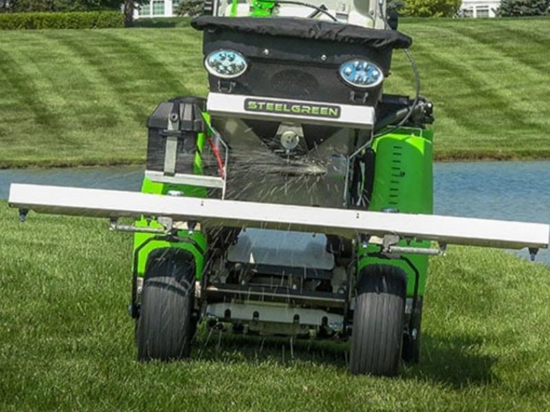 Photo of man spraying lawn for weed control