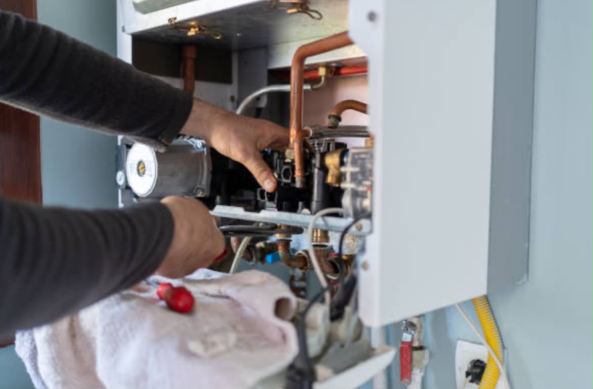Central heating service in Godalming being carried out on a gas boiler