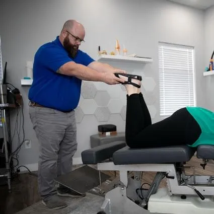 Patient receiving extremity chiropractic care