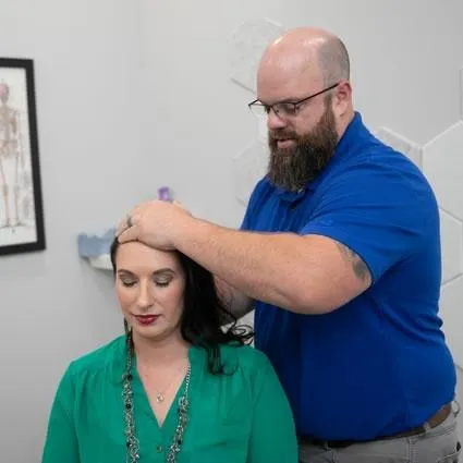 Chiropractic adjustment in progress at Absolute Wellness