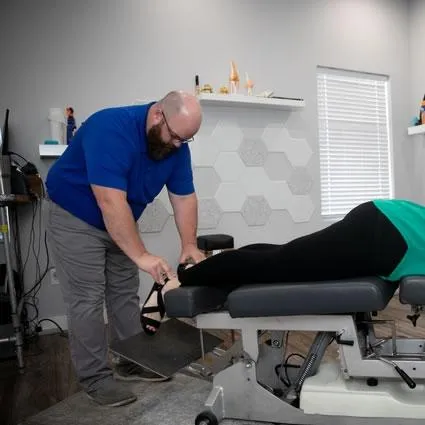 Comprehensive extremity adjustment session at Peoria IL chiropractic clinic