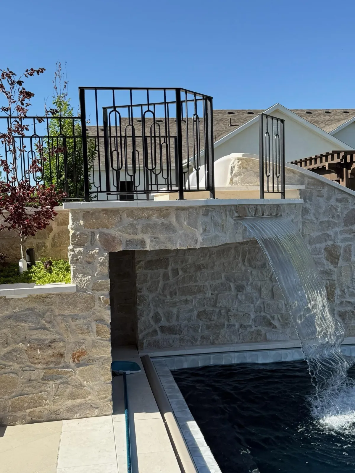 Metal railing in a beautiful backyard