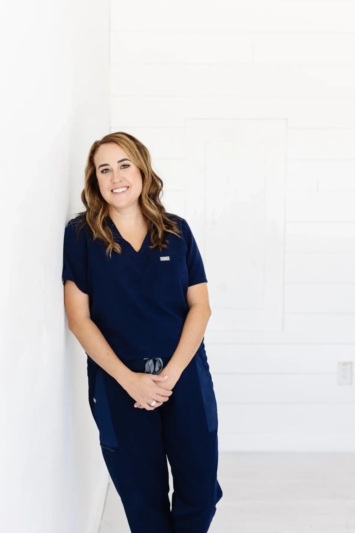 Lauren Singh, RN, in navy scrubs at Sky Women's Health