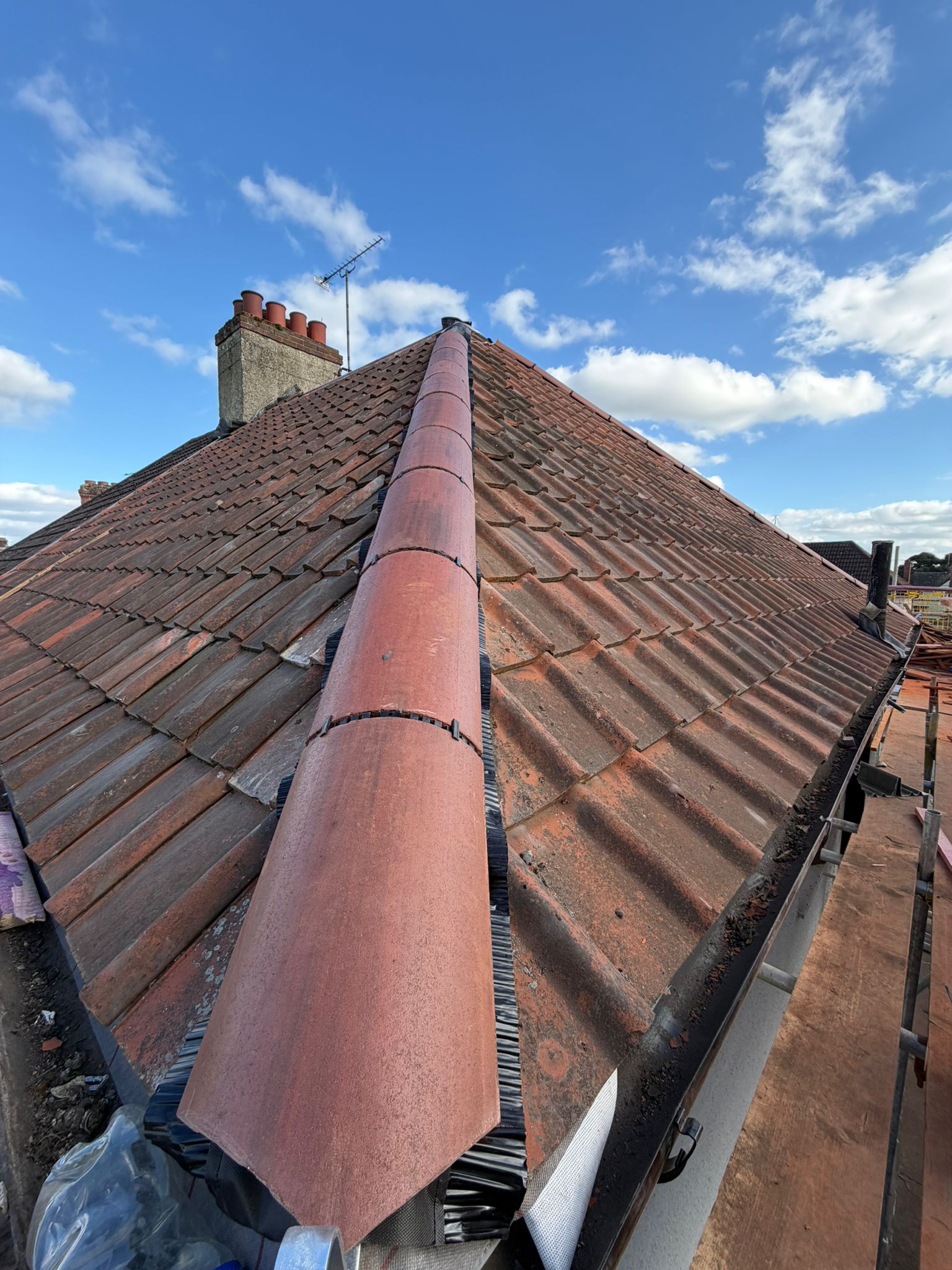 Roof ridge tile replacement and pitched roof repair
