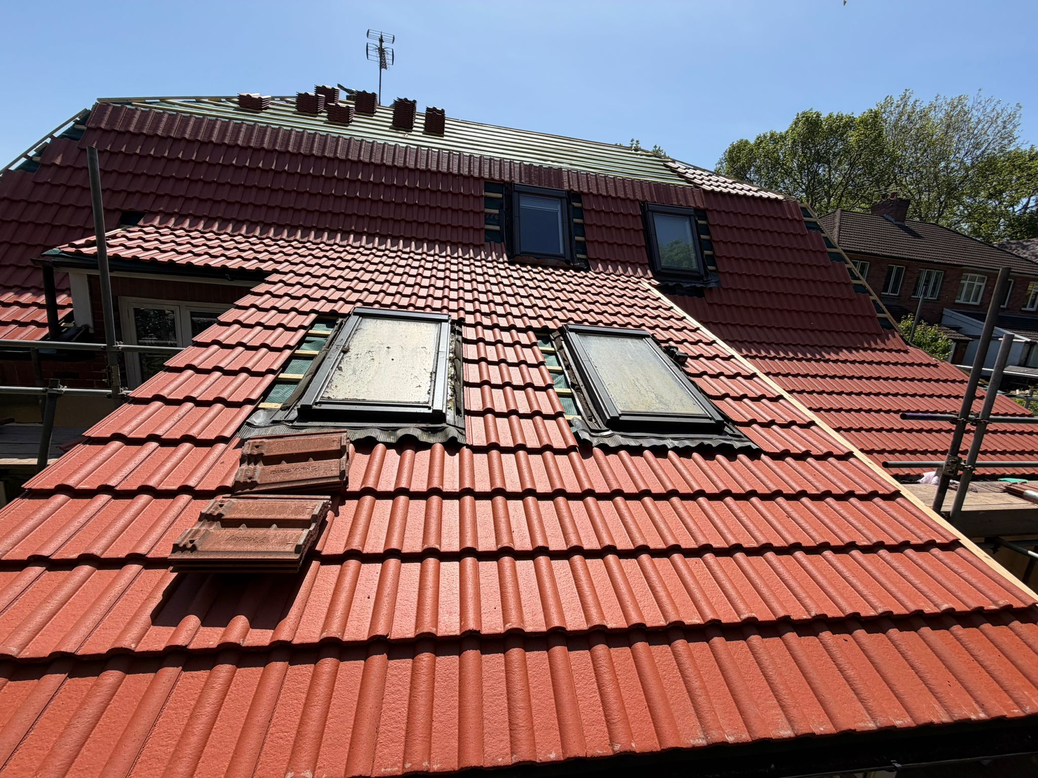 Complete roof renovation with new clay tile roofing system