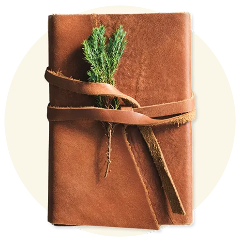 Leather journal representing higher purpose and vision building coaching