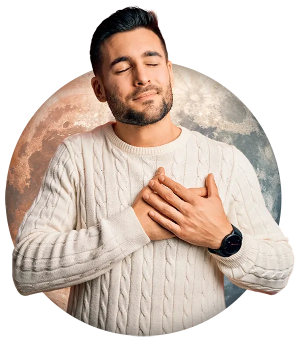Man placing hands on his heart with moon imagery for higher purpose and vision building coaching