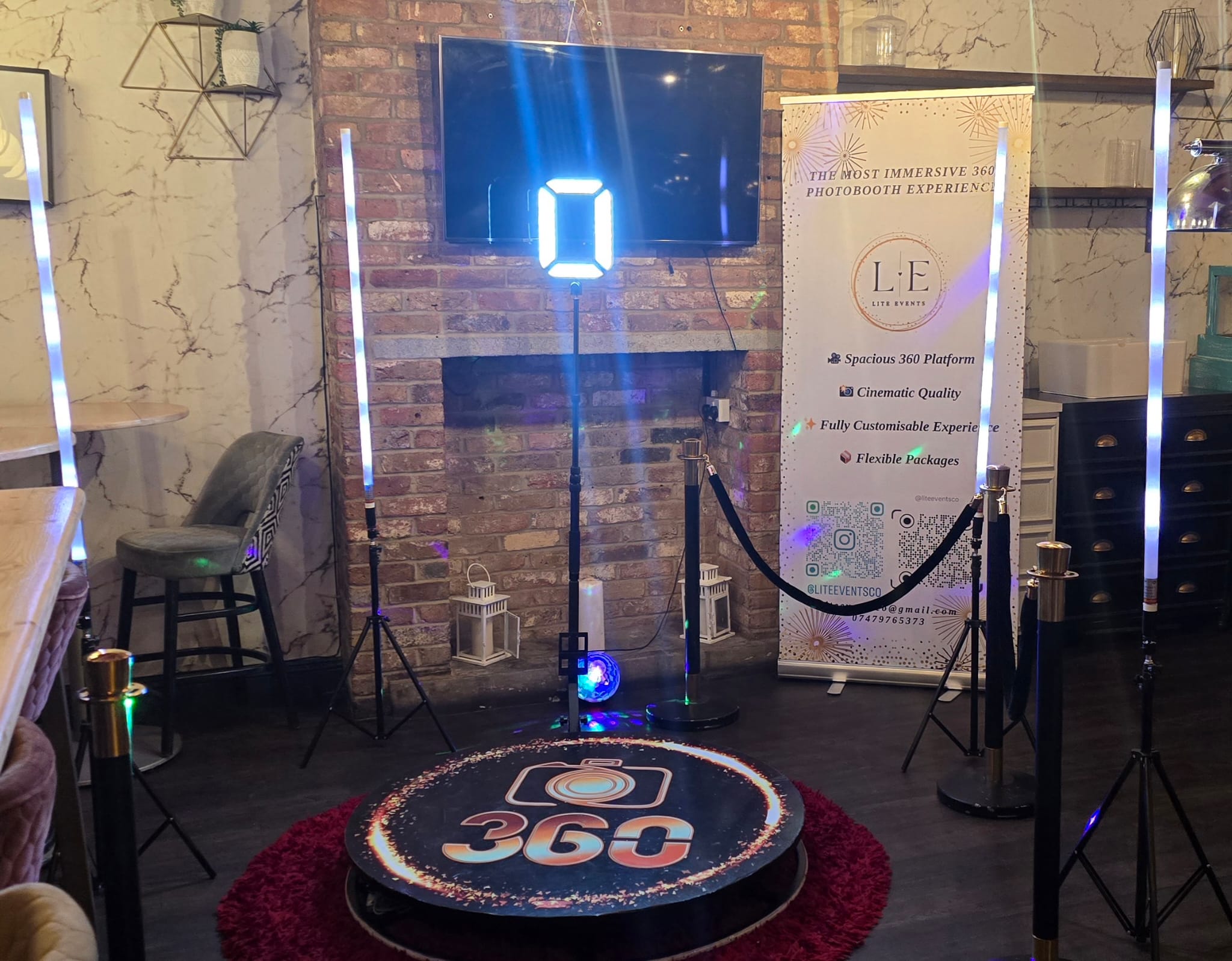 Elegant wedding cake display with floral arrangements