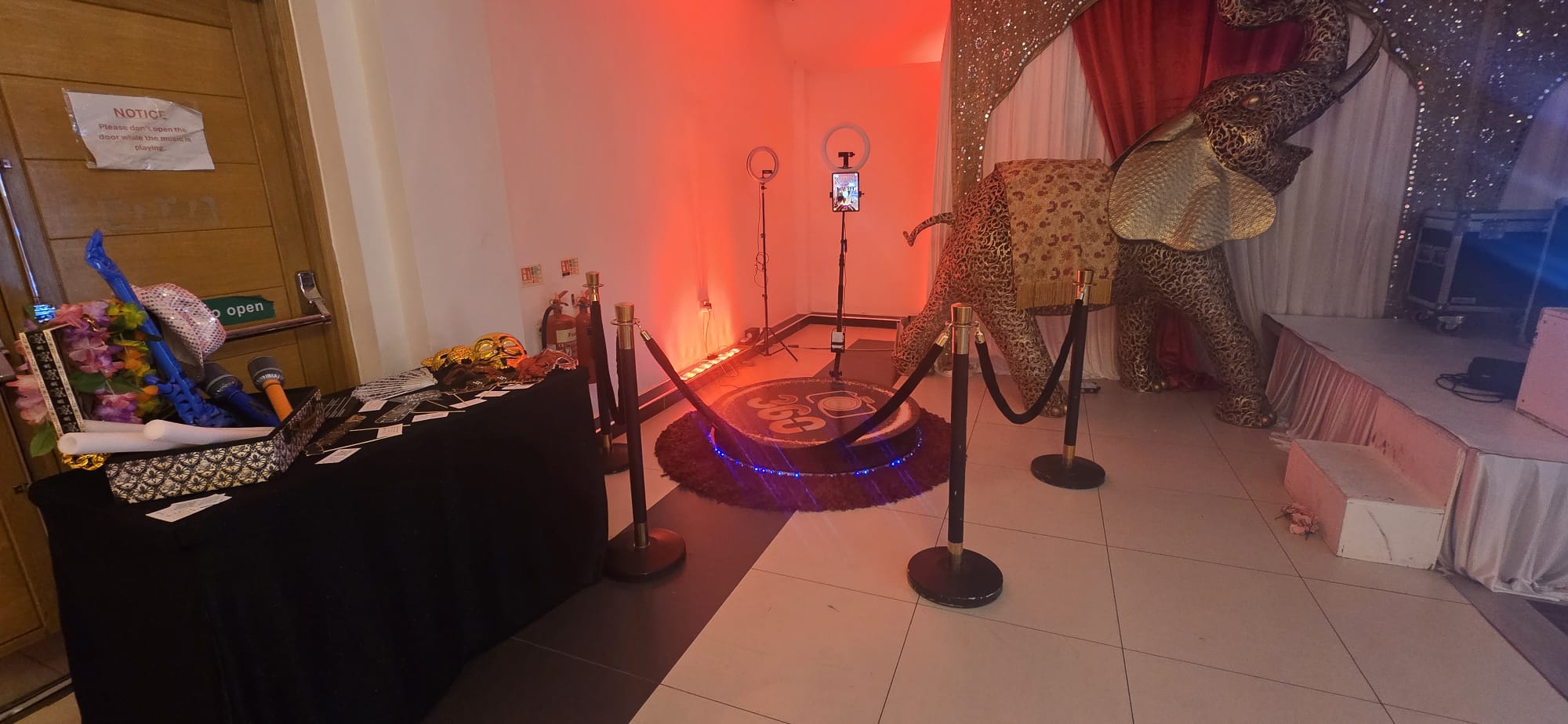 clear glass bottle beside brown woven basket with fruits on table