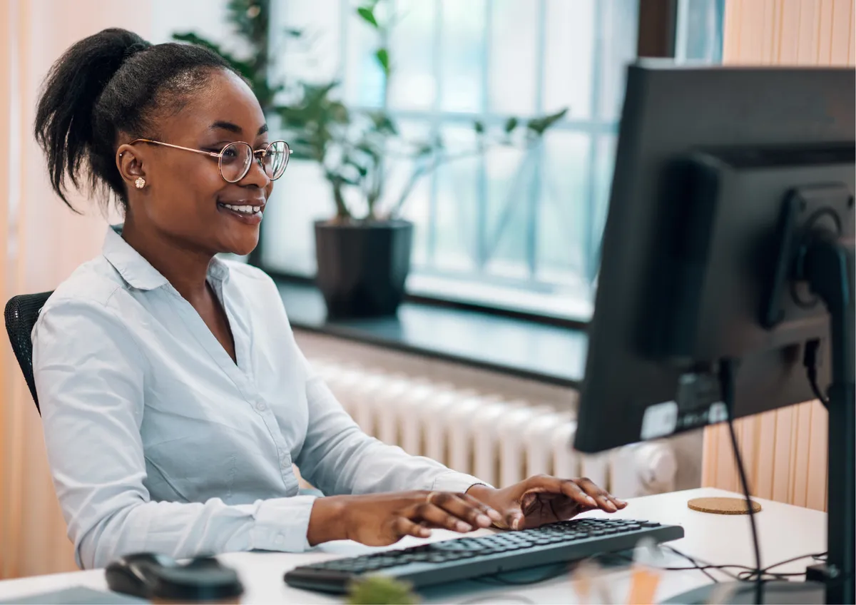 A young adult at Better Steps practices a workplace task with focus and confidence.
